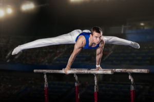 Boy-gymnast-parallel-bars